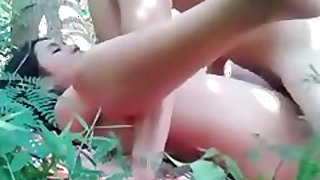 Oriental girlfriend getting drilled in the woods