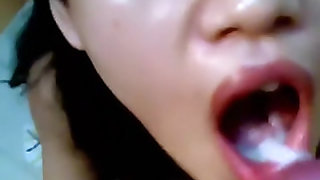 Diminutive Indonesian hottie gives head and swallows the cum