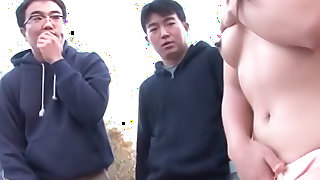 Outdoors with a hot mature Japanese woman sucking multiple cocks