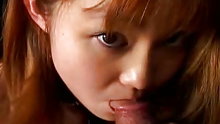 Pleasing and redhead asian  is sucking big meat stick