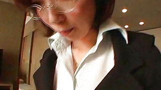 Short haired japanese office lady with glasses is posing indoors